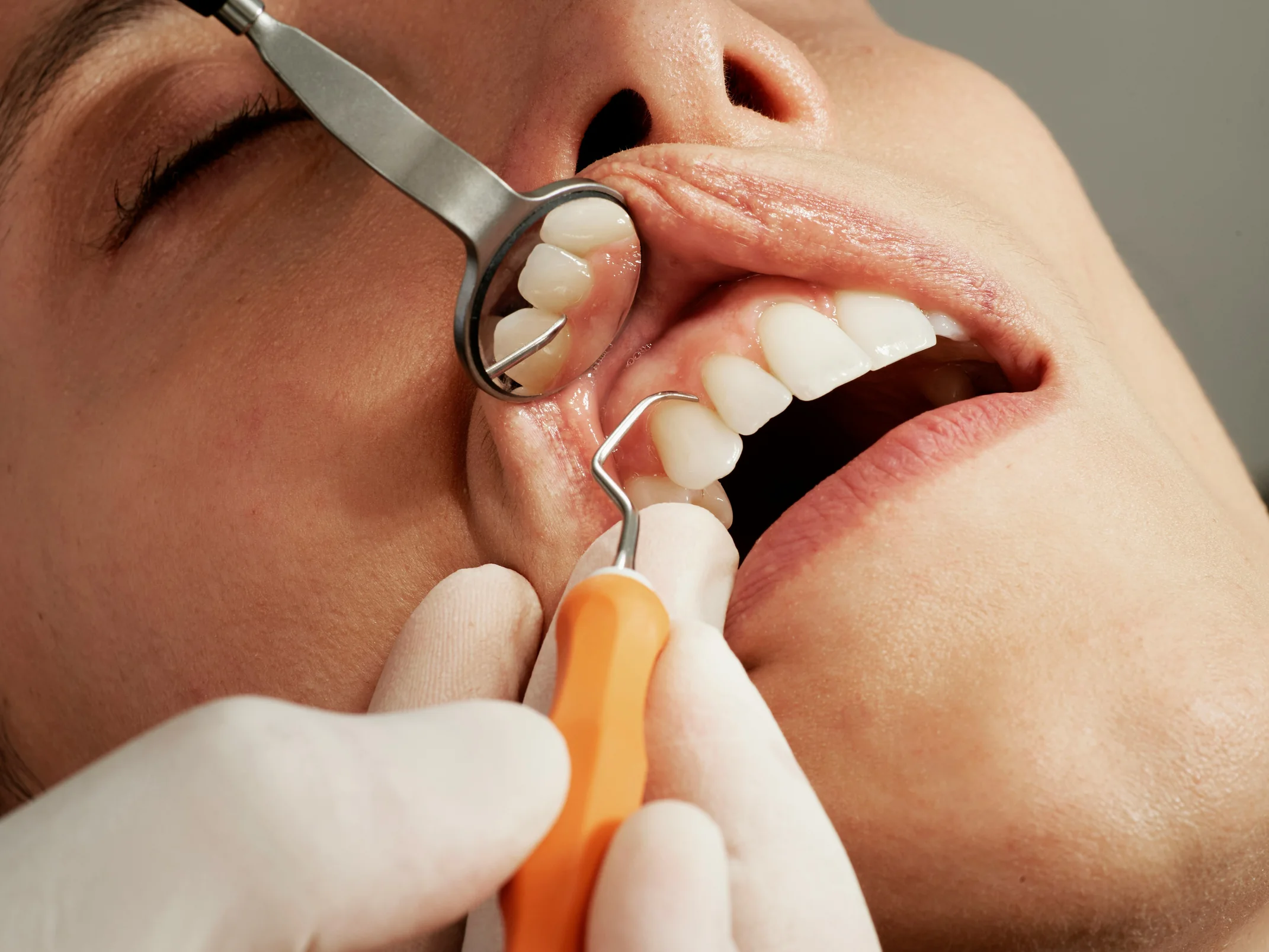 Patient reclining comfortably during gentle dental examination